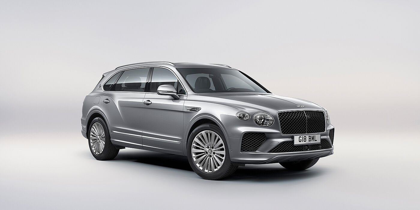 Bentley Guatemala Bentley Bentayga Extended Wheelbase luxury SUV front three quarter view in Moonbeam paint with 21 inch five spoke painted wheels