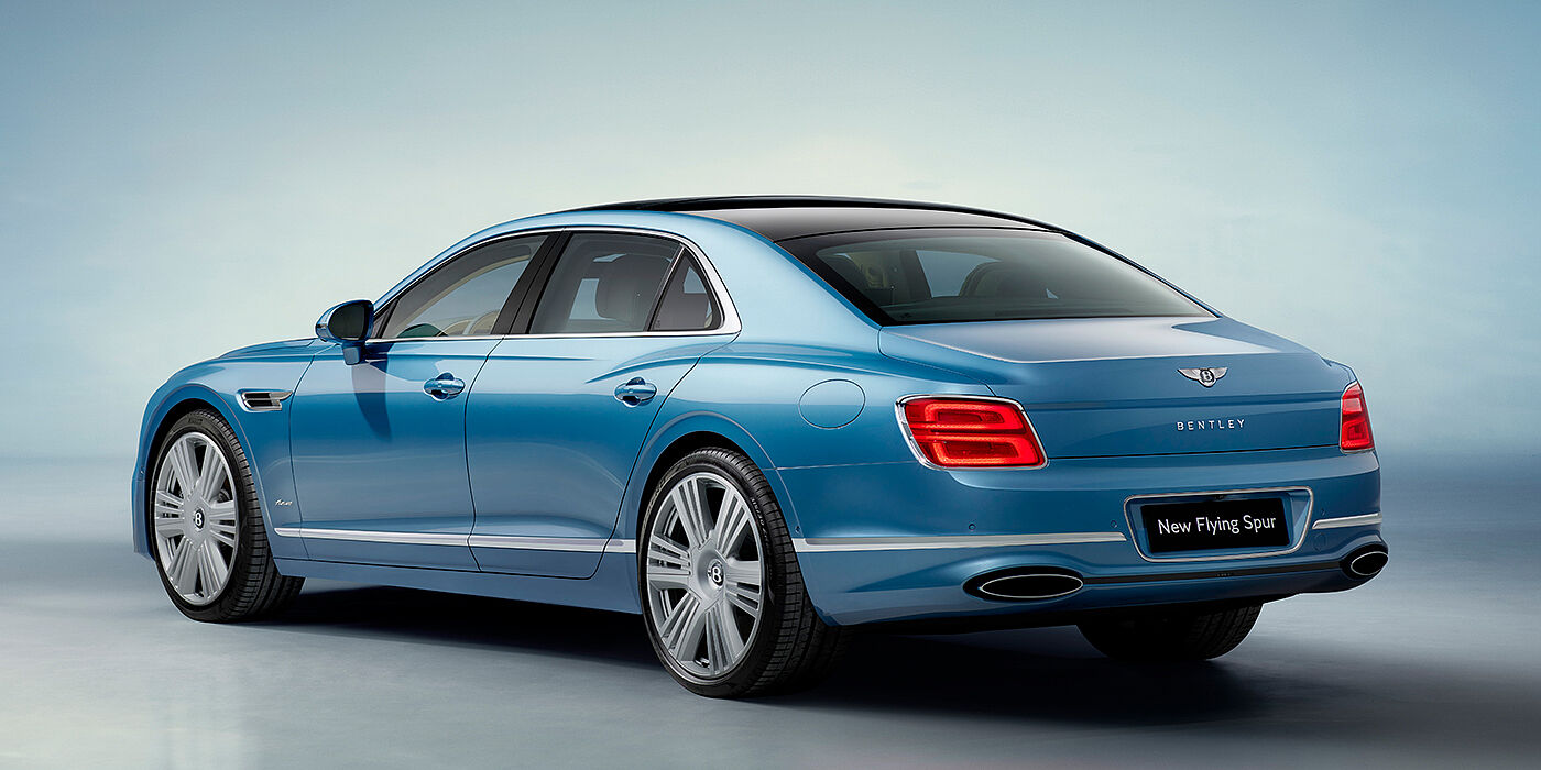 Bentley Guatemala New Bentley Flying Spur Azure sedan rear view in Light windsor blue by Mulliner paint with 22 inch Azure wheels and chrome exterior details