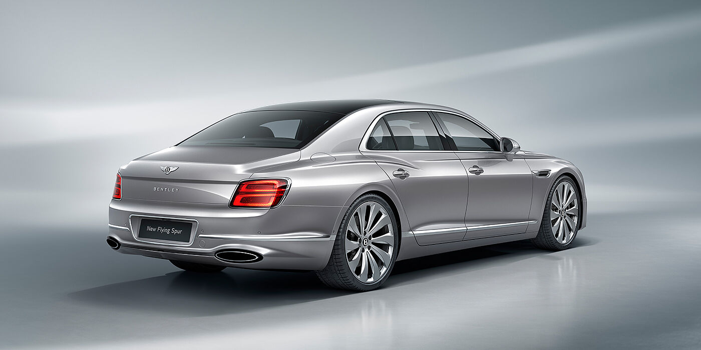 Bentley Guatemala New Bentley Flying Spur sedan rear view in Silverlake paint with ten spoke wheels and chrome matrix grille