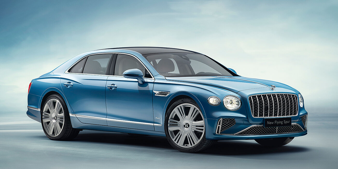Bentley Guatemala New Bentley Flying Spur Azure sedan front view in Light windsor blue by Mulliner paint with 22 inch Azure wheels and chrome exterior details