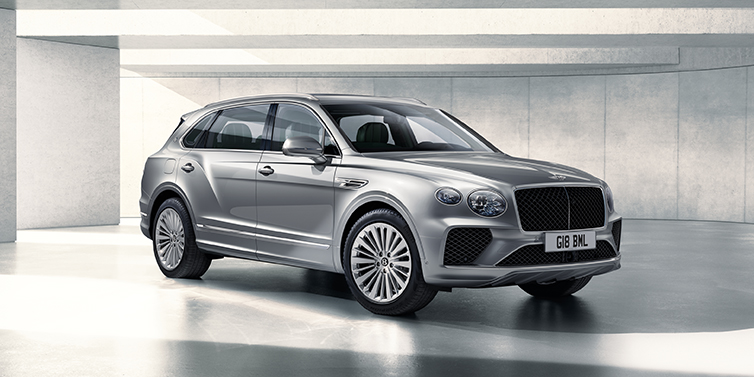Bentley Guatemala Bentley Bentayga Extended Wheelbase SUV front three quarter in Moonbeam paint with a grey background