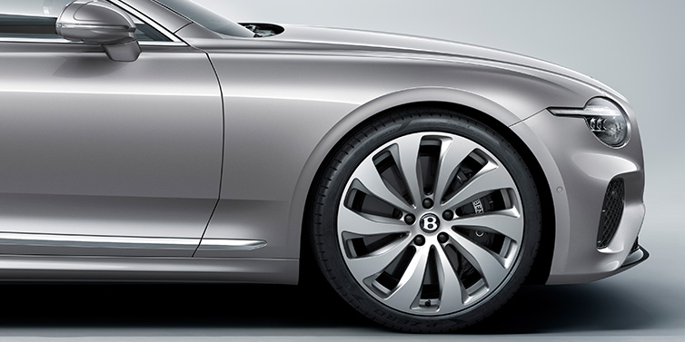 Bentley Guatemala New Bentley Continental GT coupe side view featuring bonnet in Silverlake paint and 22 inch ten spoke silver painted and bright machined wheel