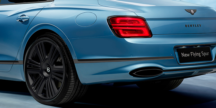 Bentley Guatemala New Bentley Flying Spur Azure sedan in Light windsor blue by Mulliner paint and Black Specification, showing 22 inch Black Azure wheel, black exhaust pipes and exterior features