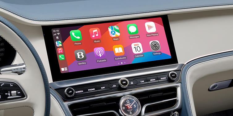 Bentley Guatemala New Bentley Flying Spur Azure sedan front cabin central MMI screen showing available services against Linen and Brunel hides and Piano Linen veneer