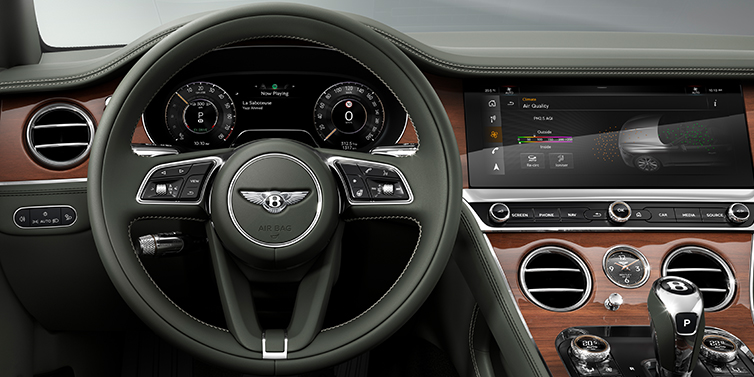 Bentley Guatemala New Bentley Continental GT coupe steering wheel and front cabin view in Cumbrian Green hide and Crown Cut walnut veneer